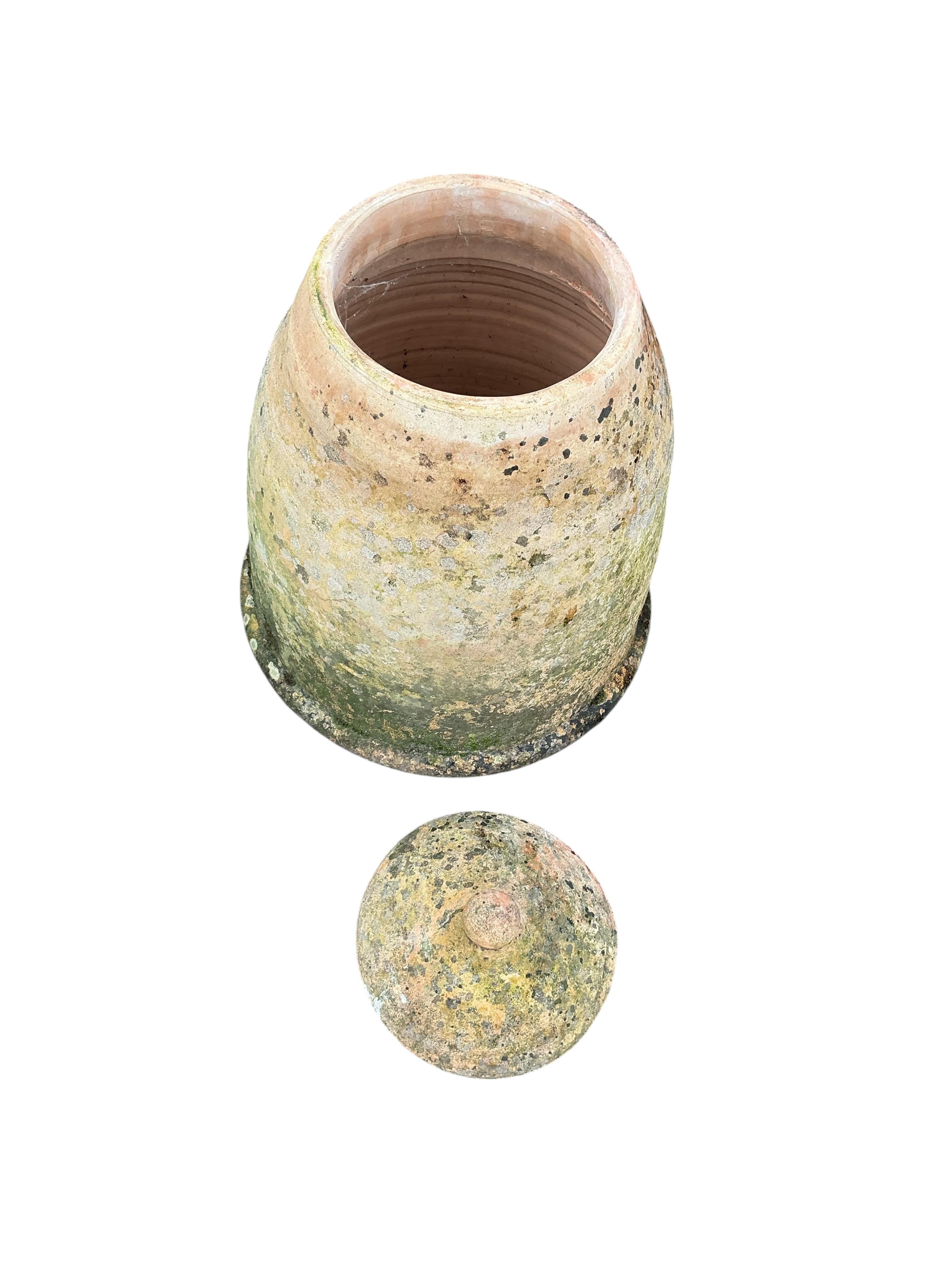 Two circular earthenware rhubarb forcers and covers, height 46cm